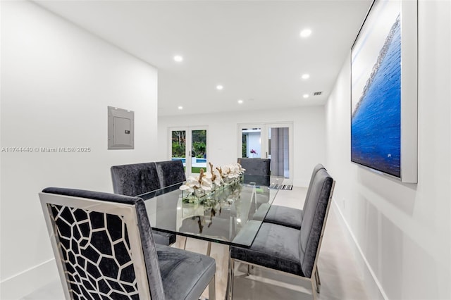 dining room featuring french doors and electric panel