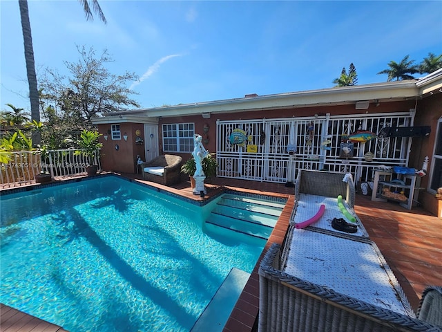 view of pool featuring a deck