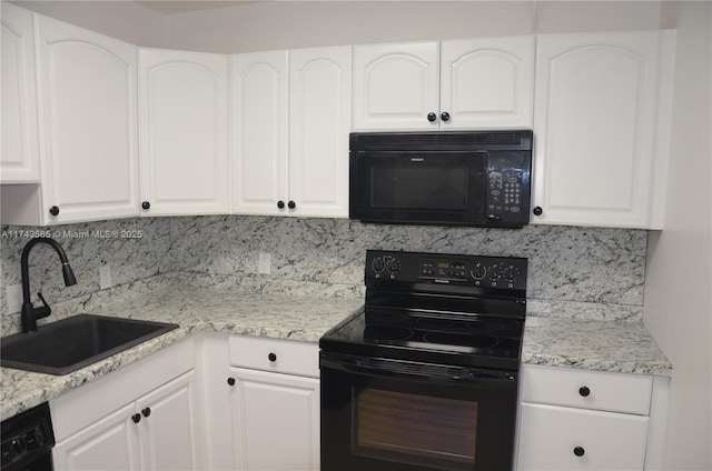 kitchen with sink, white cabinetry, light stone counters, tasteful backsplash, and black appliances