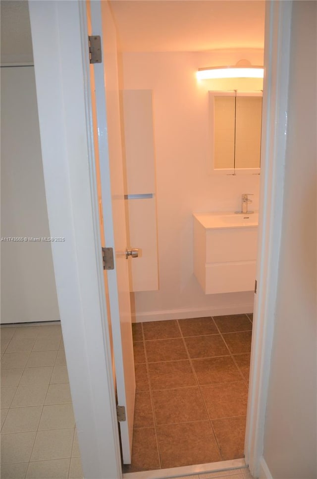 bathroom with tile patterned flooring and vanity