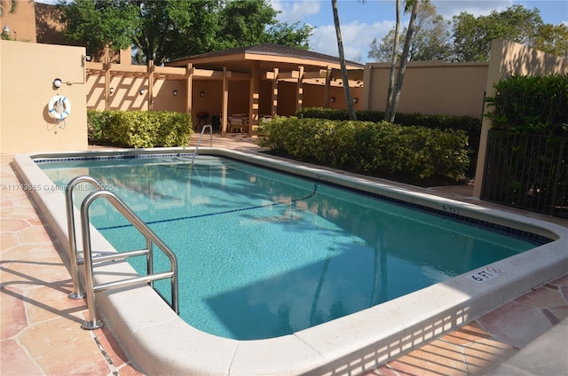 view of swimming pool featuring a patio area