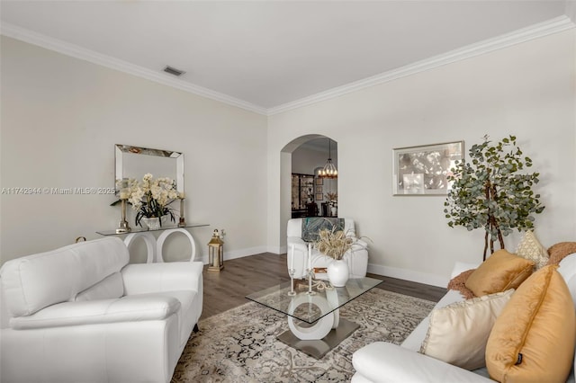 living room featuring ornamental molding and wood-type flooring