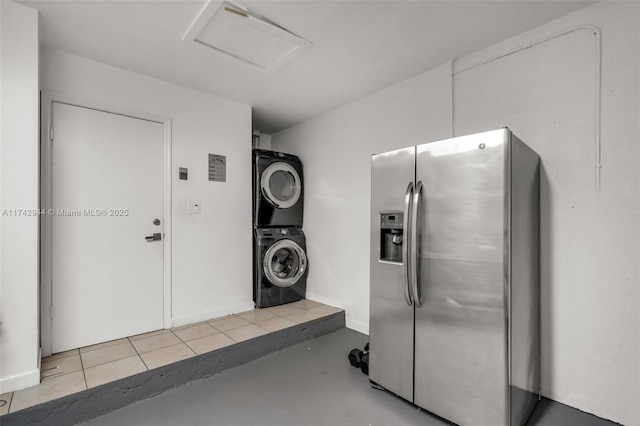 laundry room with stacked washing maching and dryer