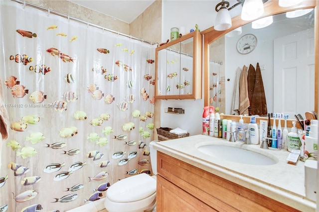 bathroom featuring vanity and toilet