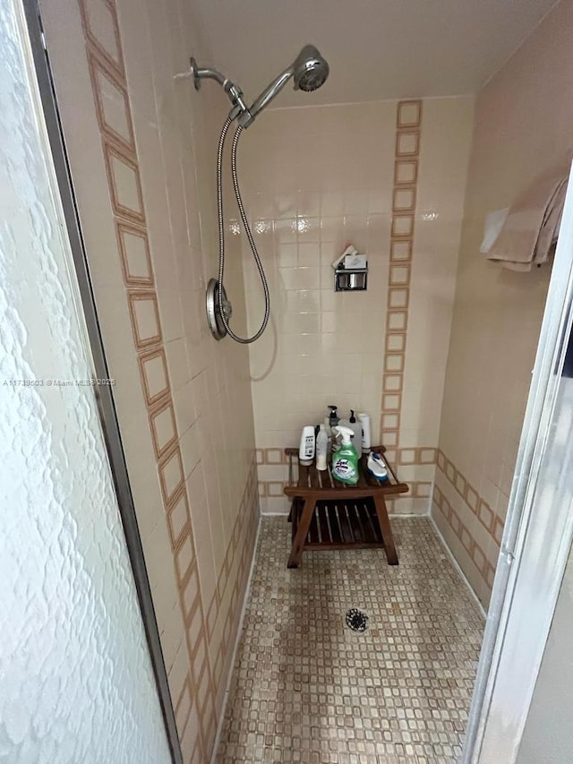 bathroom with tiled shower