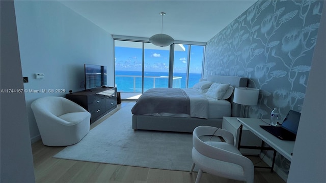 17001 Collins Ave Unit 2702, Sunny Isles Beach, FL 33160 - bedroom featuring wood finished floors and expansive windows