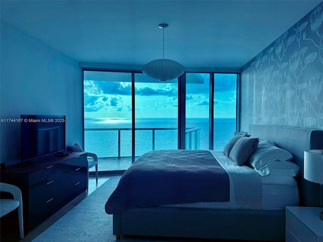 17001 Collins Ave Unit 2702, Sunny Isles Beach, FL 33160 - bedroom with wallpapered walls, multiple windows, floor to ceiling windows, and a water view
