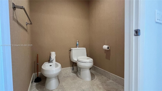 17001 Collins Ave Unit 2702, Sunny Isles Beach, FL 33160 - bathroom with a bidet and toilet
