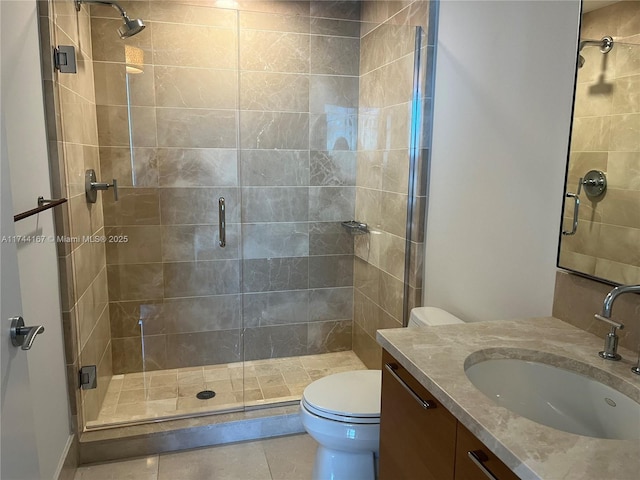 17001 Collins Ave Unit 2702, Sunny Isles Beach, FL 33160 - full bathroom with vanity, a shower stall, toilet, and tile patterned flooring
