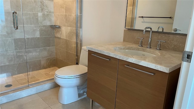 17001 Collins Ave Unit 2702, Sunny Isles Beach, FL 33160 - bathroom featuring vanity, a shower stall, toilet, and tile patterned floors