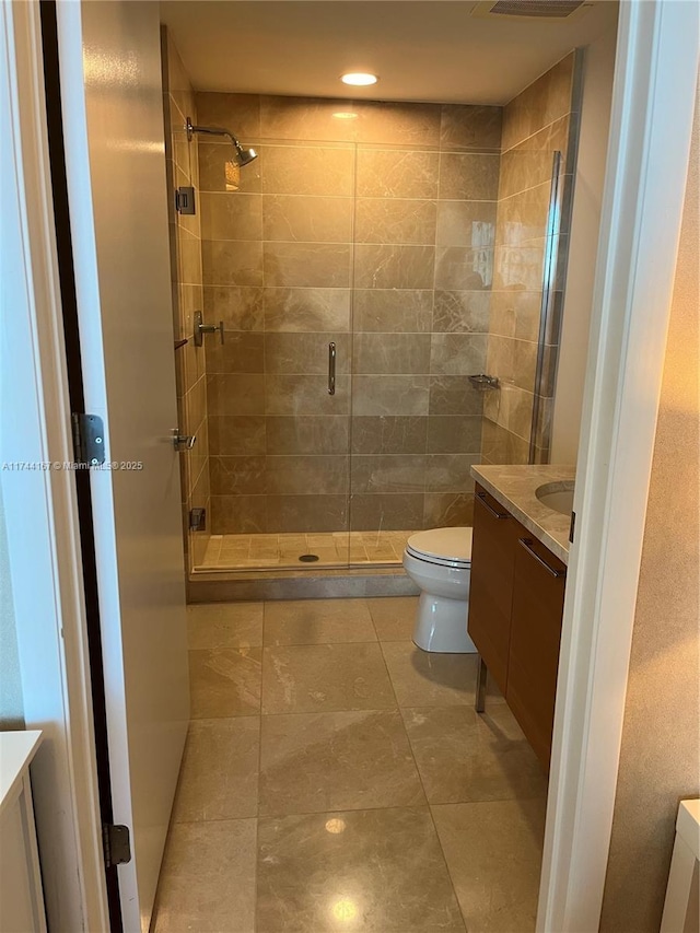 17001 Collins Ave Unit 2702, Sunny Isles Beach, FL 33160 - bathroom featuring vanity, toilet, a stall shower, and recessed lighting