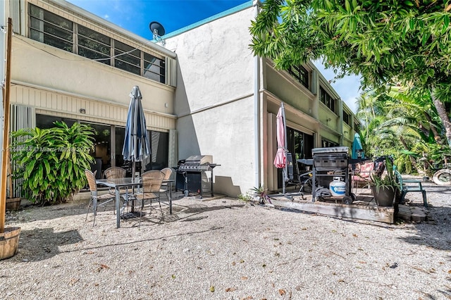 back of house with a patio