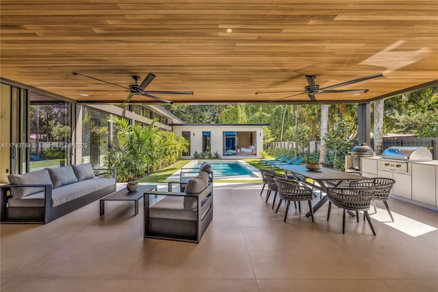 view of patio / terrace with grilling area, a fenced in pool, ceiling fan, and an outdoor structure