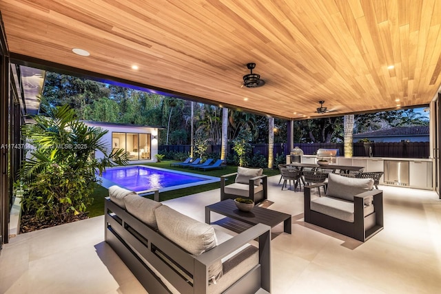 view of patio / terrace with grilling area, a fenced in pool, an outdoor hangout area, an outbuilding, and ceiling fan