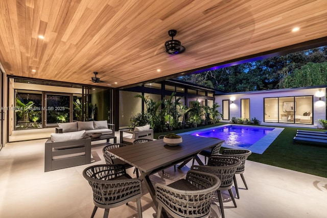 view of pool with ceiling fan, a patio area, and outdoor lounge area