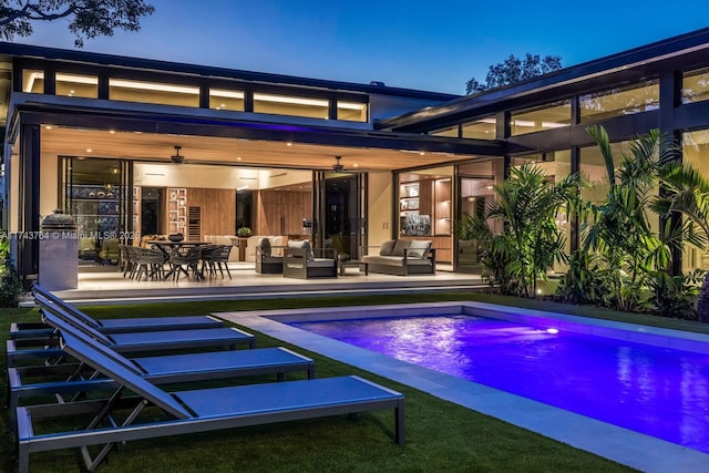 exterior space featuring a patio area, ceiling fan, and an outdoor hangout area