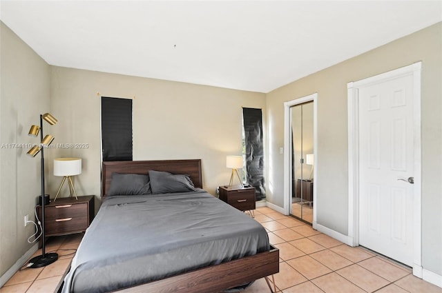 bedroom with light tile patterned floors