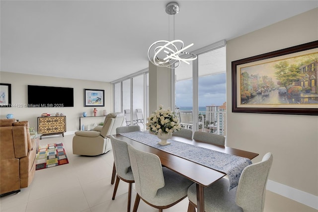 dining area featuring expansive windows and a chandelier