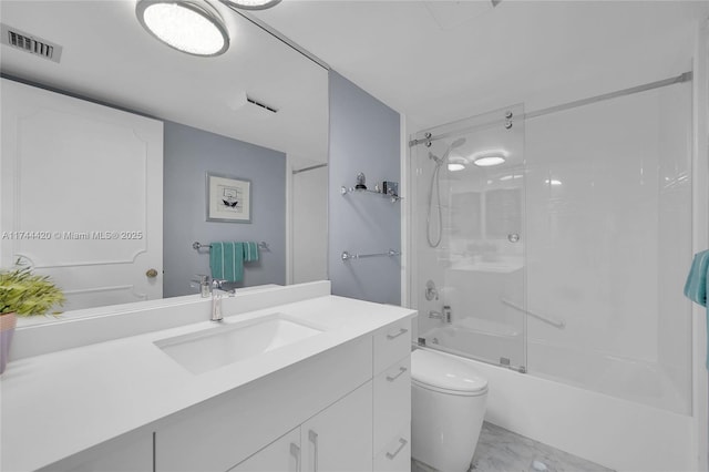 full bathroom featuring washtub / shower combination, vanity, and toilet