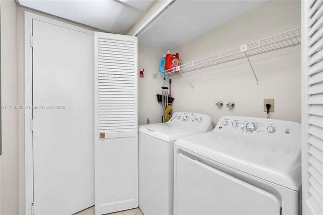 laundry area with washing machine and dryer