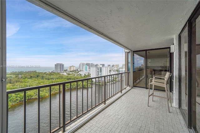 balcony featuring a water view