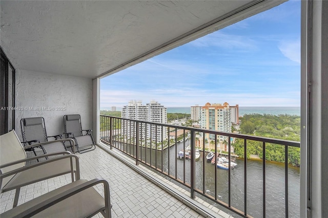 balcony featuring a water view