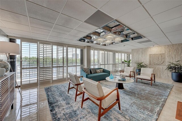 936 Intracoastal Dr Unit 20E, Fort Lauderdale, FL 33304 - living area with a paneled ceiling and a wall of windows
