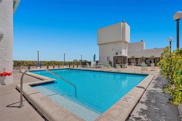 view of swimming pool with a patio area