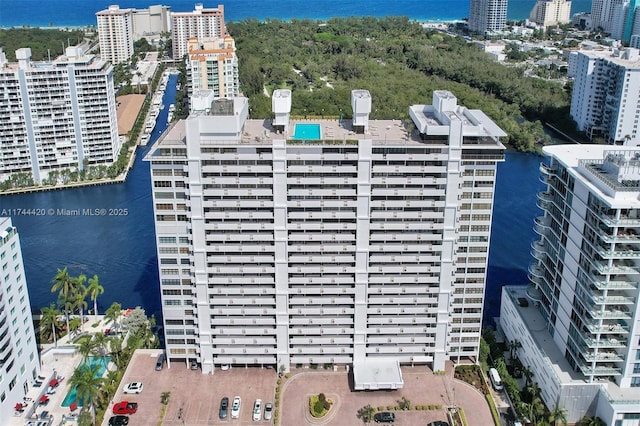 birds eye view of property with a water view