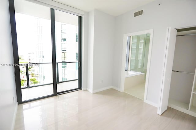 interior space featuring floor to ceiling windows