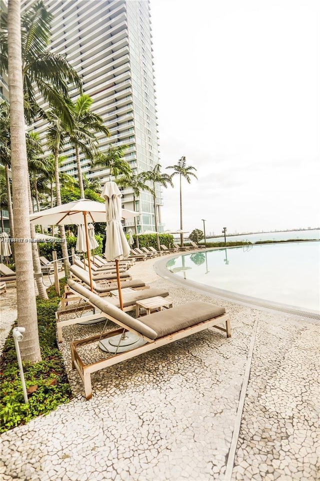 view of property's community with a patio and a swimming pool