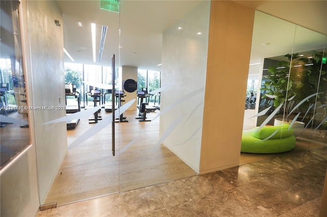 workout area featuring a wall of windows