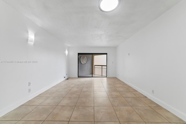 empty room with light tile patterned floors