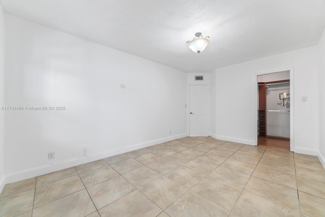 view of tiled spare room