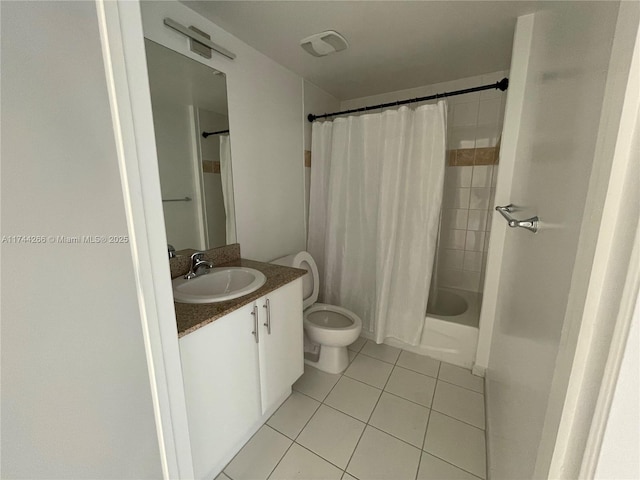 bathroom featuring tile patterned floors, shower / tub combo, toilet, and vanity