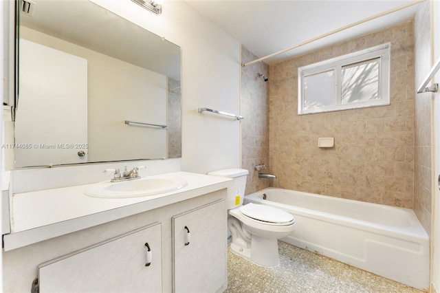 full bathroom with vanity, toilet, and tiled shower / bath combo