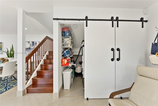 stairway featuring a barn door