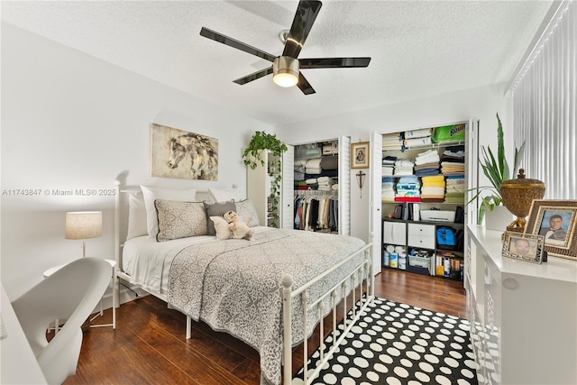 bedroom featuring ceiling fan, a closet, dark wood-type flooring, and a textured ceiling