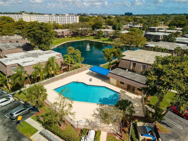 view of pool featuring a water view