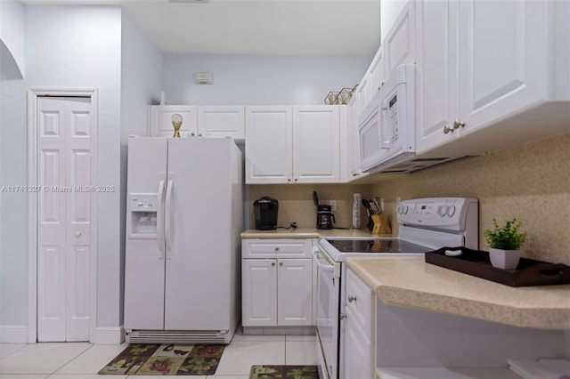 20173 SW 128th Pl, Miami, FL 33177 - kitchen with white appliances, white cabinetry, and light tile patterned floors