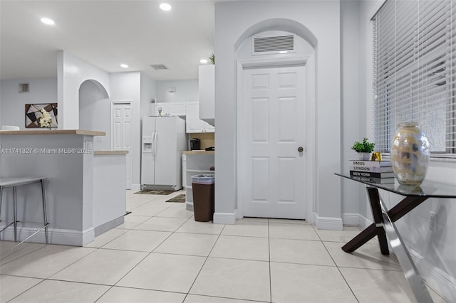 20173 SW 128th Pl, Miami, FL 33177 - kitchen with white cabinets, white refrigerator with ice dispenser, and light tile patterned floors