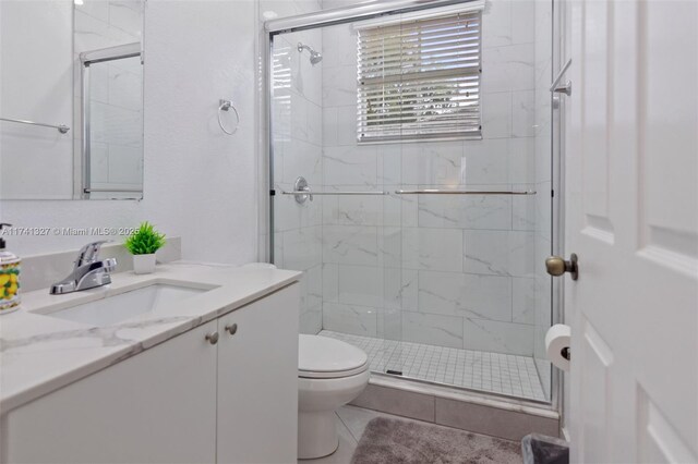 20173 SW 128th Pl, Miami, FL 33177 - bathroom featuring vanity, an enclosed shower, toilet, and tile patterned floors