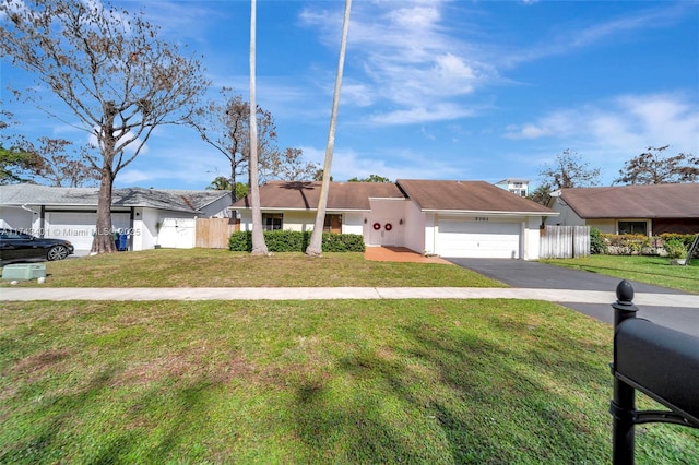 view of front facade featuring a garage and a front lawn