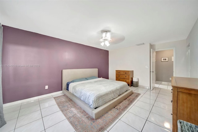 bedroom with light tile patterned flooring and ceiling fan