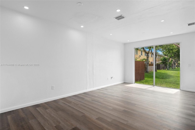 empty room with dark wood-type flooring