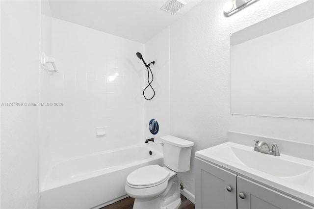 full bathroom with vanity, tiled shower / bath combo, wood-type flooring, and toilet