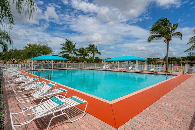 view of swimming pool featuring a gazebo and a patio area