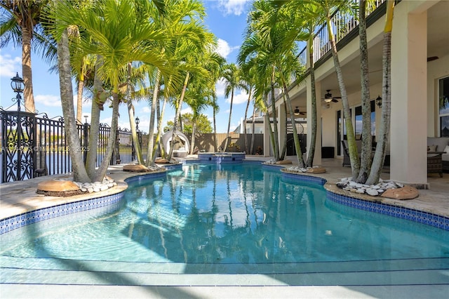 view of pool featuring ceiling fan and a patio area