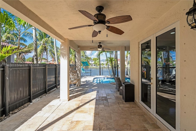 view of patio with a fenced in pool