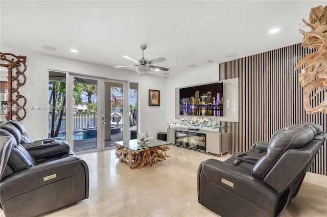 living room featuring french doors and ceiling fan